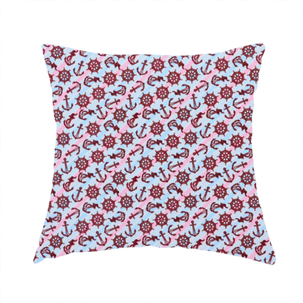 The fabric used to create this handmade cushion is a nautical-themed fabric pattern featuring diagonal stripes in light blue and pink, scattered with dark red ship's wheels and anchors.