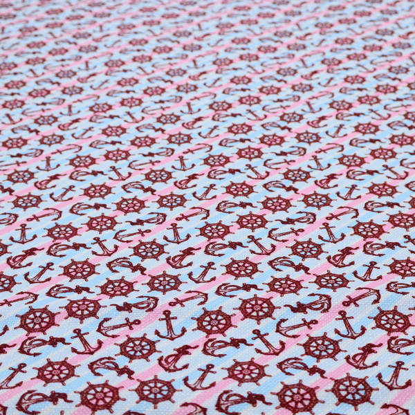 A nautical-themed fabric pattern featuring diagonal stripes in light blue and pink, scattered with dark red ship's wheels and anchors.