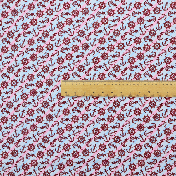 A nautical-themed fabric pattern featuring diagonal stripes in light blue and pink, scattered with dark red ship's wheels and anchors.