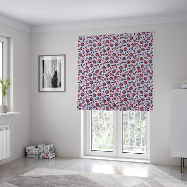 The fabric used to create these Roman blinds is a nautical-themed fabric pattern featuring diagonal stripes in light blue and pink, scattered with dark red ship's wheels and anchors.