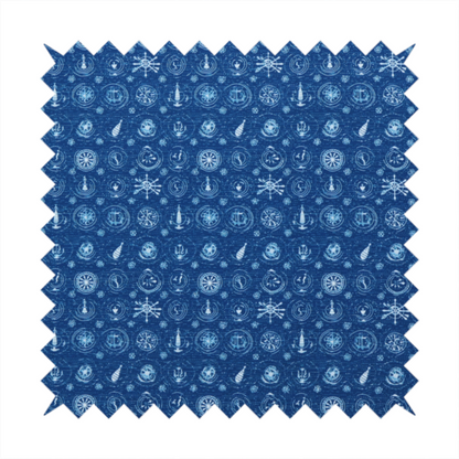A nautical-themed fabric pattern featuring an all-over small-scale print of white ship's wheels, anchors, compass roses, and nautical motifs against a textured dark blue background.