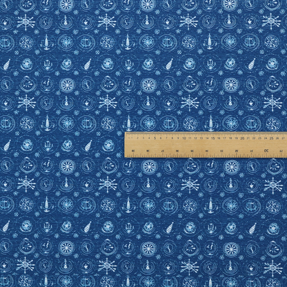 A nautical-themed fabric pattern featuring an all-over small-scale print of white ship's wheels, anchors, compass roses, and nautical motifs against a textured dark blue background.