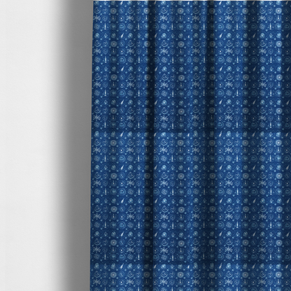 The fabric used to create these made-to-measure curtains is a nautical-themed fabric pattern featuring an all-over small-scale print of white ship's wheels, anchors, compass roses, and nautical motifs against a textured dark blue background.
