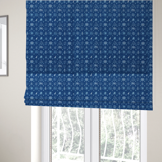 The fabric used to create these Roman blinds is a nautical-themed fabric pattern featuring an all-over small-scale print of white ship's wheels, anchors, compass roses, and nautical motifs against a textured dark blue background.