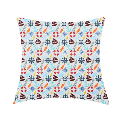 The fabric used to create this handmade cushion is a colourful nautical-themed fabric pattern featuring a repeating mix of lighthouses, sailboats, life rings, ship's wheels, anchors, and waves against a white background.
