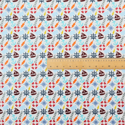 A colourful nautical-themed fabric pattern featuring a repeating mix of lighthouses, sailboats, life rings, ship's wheels, anchors, and waves against a white background.