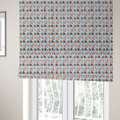 The fabric used to create these Roman blinds is a colourful nautical-themed fabric pattern featuring a repeating mix of lighthouses, sailboats, life rings, ship's wheels, anchors, and waves against a white background.