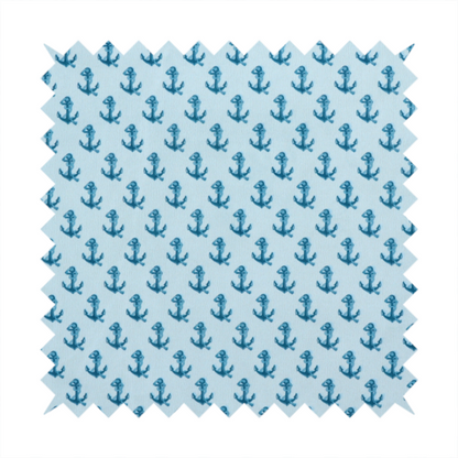 A nautical-themed fabric pattern featuring a repeating print of dark blue anchors against a light blue background.