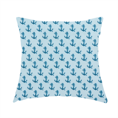 The fabric used to create this handmade cushion is a nautical-themed fabric pattern featuring a repeating print of dark blue anchors against a light blue background.
