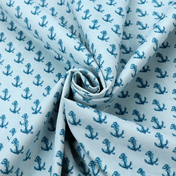 A nautical-themed fabric pattern featuring a repeating print of dark blue anchors against a light blue background.