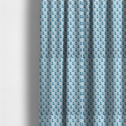 The fabric used to create these made-to-measure curtains is a nautical-themed fabric pattern featuring a repeating print of dark blue anchors against a light blue background.