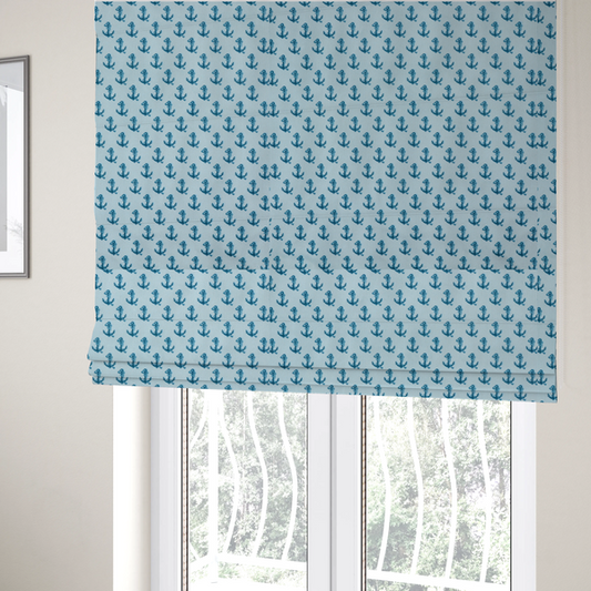 The fabric used to create these Roman blinds is a nautical-themed fabric pattern featuring a repeating print of dark blue anchors against a light blue background.