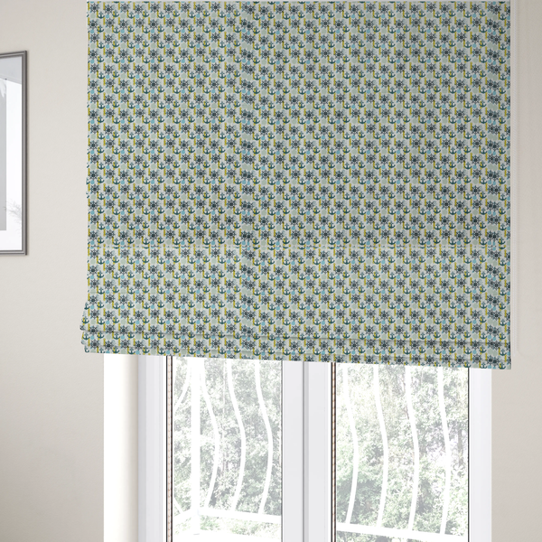 The fabric used to create these Roman blinds is a pattern features a nautical theme consisting of ships' steering wheels, anchors, and vertical chains.