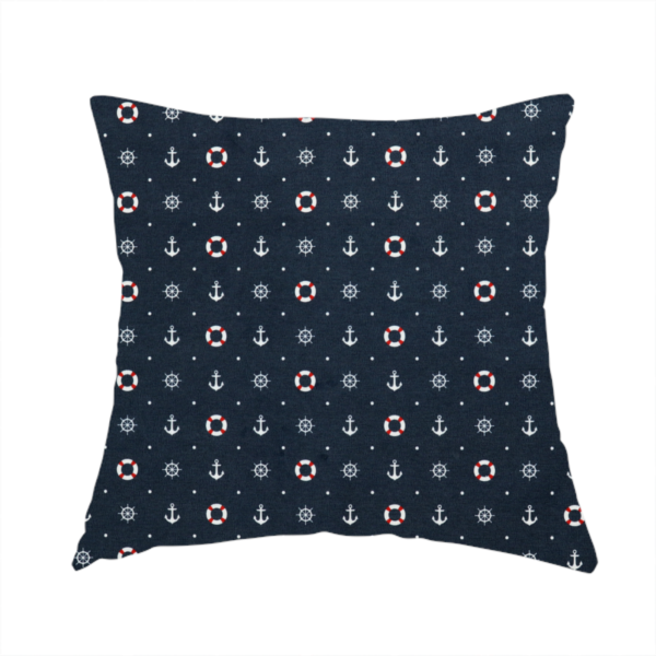 The fabric used to create this handmade cushion is a pattern features a nautical-themed design consisting of alternating rows and grids of white anchors, ship's steering wheels, and red-and-white lifebuoys, accented by small white polka dots.