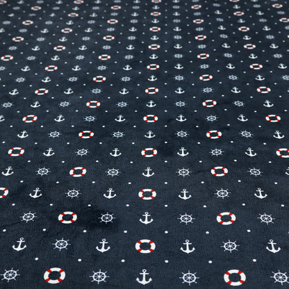 The pattern features a nautical-themed design consisting of alternating rows and grids of white anchors, ship's steering wheels, and red-and-white lifebuoys, accented by small white polka dots.