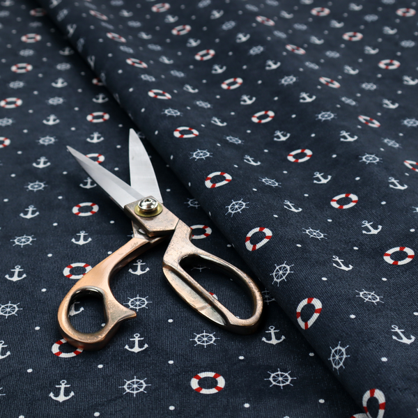 The pattern features a nautical-themed design consisting of alternating rows and grids of white anchors, ship's steering wheels, and red-and-white lifebuoys, accented by small white polka dots.