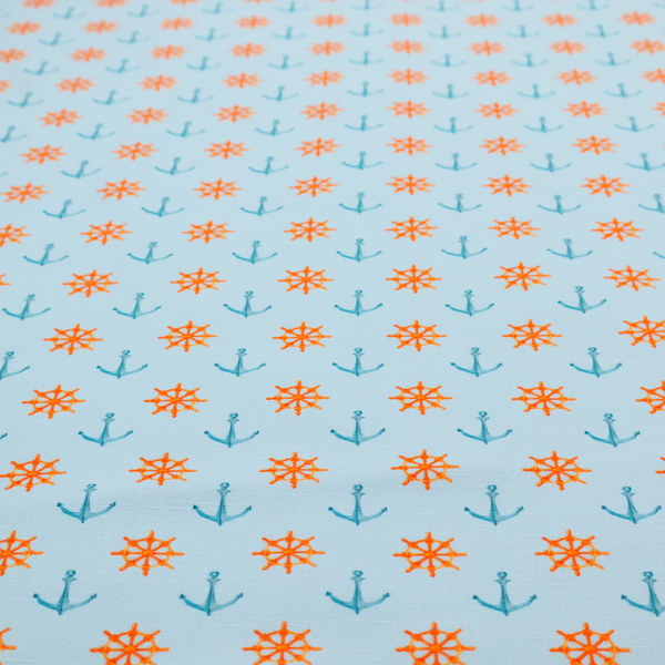 The pattern features a nautical-themed design consisting of alternating rows of ship's steering wheels and small anchors.
