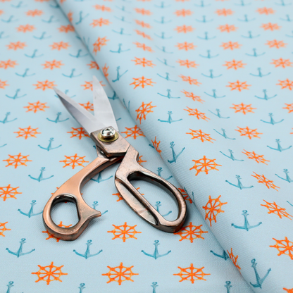 The pattern features a nautical-themed design consisting of alternating rows of ship's steering wheels and small anchors.