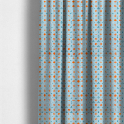 The fabric used to create these made-to-measure curtains is a  pattern features a nautical-themed design consisting of alternating rows of ship's steering wheels and small anchors.