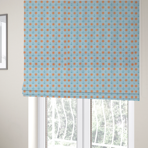 The fabric used to create these Roman blinds is a pattern features a nautical-themed design consisting of alternating rows of ship's steering wheels and small anchors.