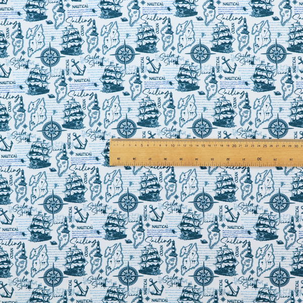 The pattern features a dense nautical collage consisting of sailing ships, maps or landmasses, compass roses, anchors, lighthouses, and cursive typography with words like "Sailing," "Ocean," "Nautical," and "Sailor Spirit."