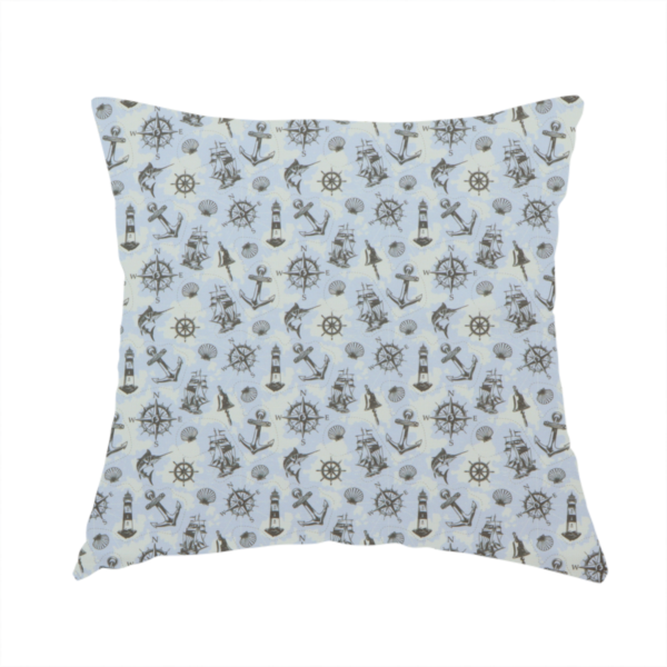 the fabric used to create this handmade cushion is a pattern features a nautical-themed collage consisting of lighthouses, sailing ships, anchors, compasses, compass roses, seashells, ship bells, and marlin fish.