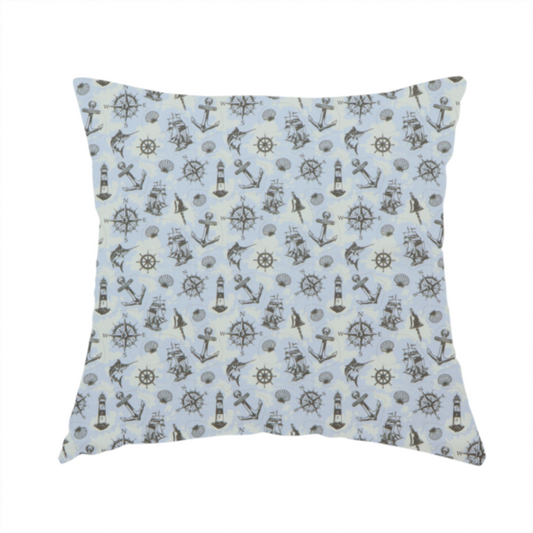 the fabric used to create this handmade cushion is a pattern features a nautical-themed collage consisting of lighthouses, sailing ships, anchors, compasses, compass roses, seashells, ship bells, and marlin fish.