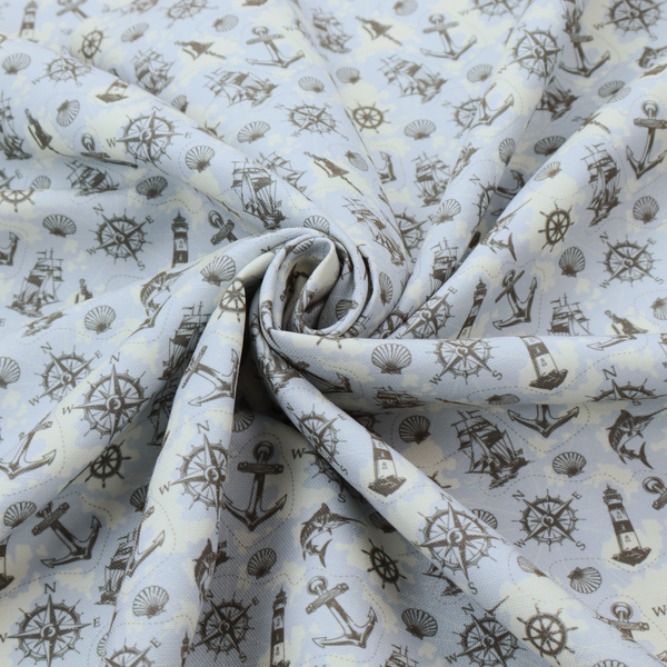 The pattern features a nautical-themed collage consisting of lighthouses, sailing ships, anchors, compasses, compass roses, seashells, ship bells, and marlin fish.