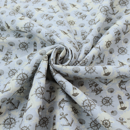 The pattern features a nautical-themed collage consisting of lighthouses, sailing ships, anchors, compasses, compass roses, seashells, ship bells, and marlin fish.