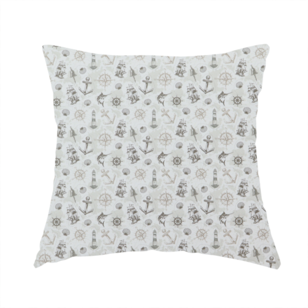 the fabric used to create this handmade cushion is a pattern features a nautical-themed collage containing lighthouses, sailing ships, anchors, compass roses, seashells, steering wheels, ship bells, and marlin fish.