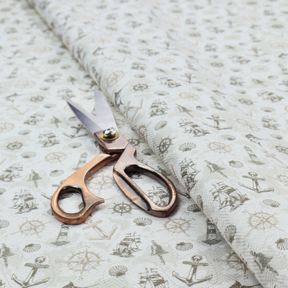 The pattern features a nautical-themed collage containing lighthouses, sailing ships, anchors, compass roses, seashells, steering wheels, ship bells, and marlin fish.
