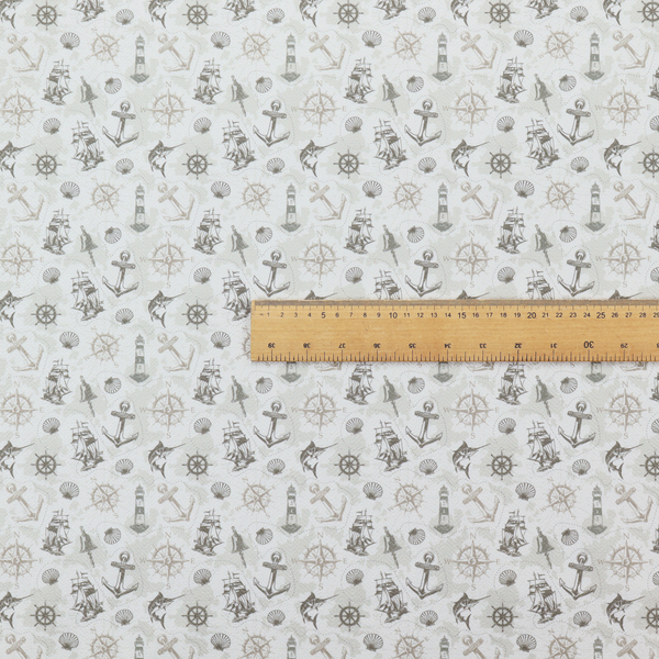 The pattern features a nautical-themed collage containing lighthouses, sailing ships, anchors, compass roses, seashells, steering wheels, ship bells, and marlin fish.