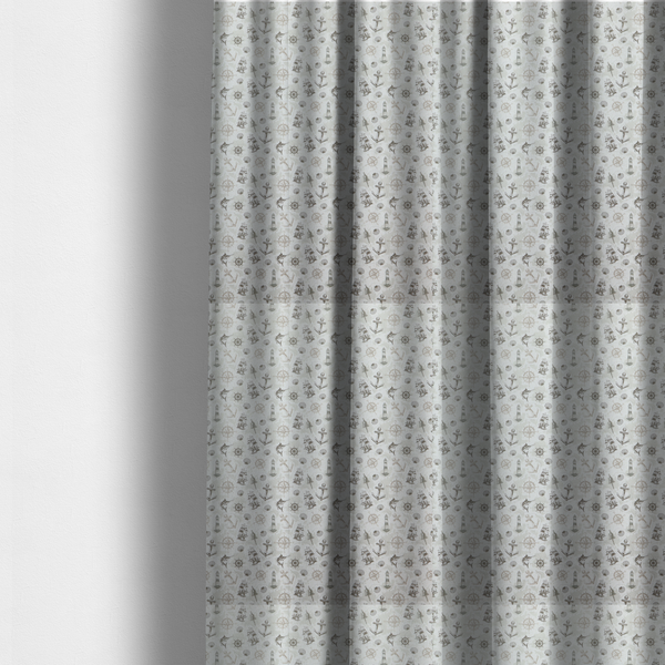 The fabric used to create these made-to-measure curtains is a pattern features a nautical-themed collage containing lighthouses, sailing ships, anchors, compass roses, seashells, steering wheels, ship bells, and marlin fish.
