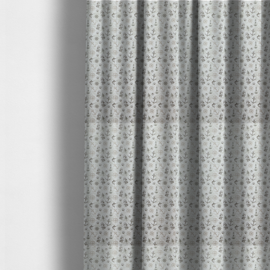 The fabric used to create these made-to-measure curtains is a pattern features a nautical-themed collage containing lighthouses, sailing ships, anchors, compass roses, seashells, steering wheels, ship bells, and marlin fish.