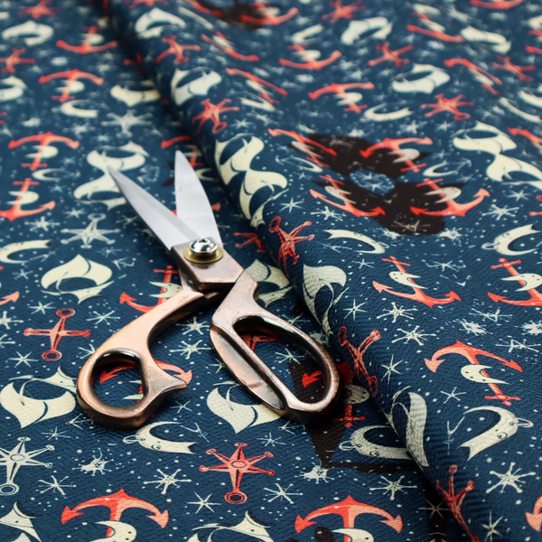 The pattern features an intricate, symmetrical nautical motif including anchors, stars, crescent shapes, and ornamental crests or panels.