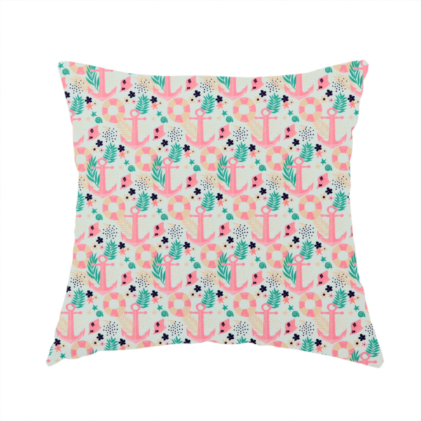 The fabric used to create this handmade cushion is a light mint green fabric with a repeating nautical pattern featuring pink anchors framed by teal palm fronds, interspersed with pink and white striped life rings, tiny dark blue flowers, and small coral shells.