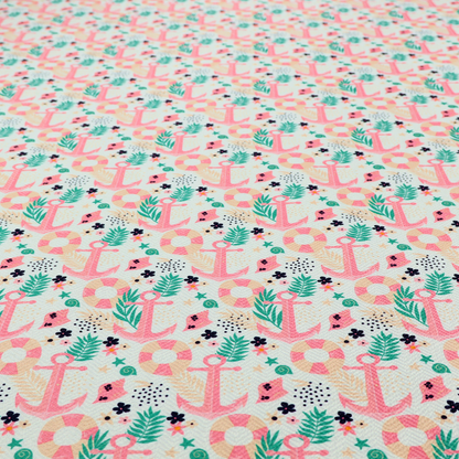 A light mint green fabric with a repeating nautical pattern featuring pink anchors framed by teal palm fronds, interspersed with pink and white striped life rings, tiny dark blue flowers, and small coral shells.