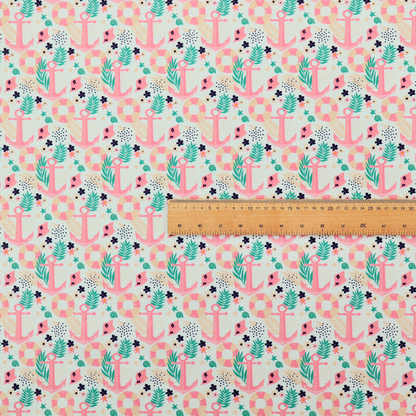 A light mint green fabric with a repeating nautical pattern featuring pink anchors framed by teal palm fronds, interspersed with pink and white striped life rings, tiny dark blue flowers, and small coral shells.