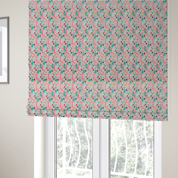 The fabric used to create these Roman blinds is a light mint green fabric with a repeating nautical pattern featuring pink anchors framed by teal palm fronds, interspersed with pink and white striped life rings, tiny dark blue flowers, and small coral shells.