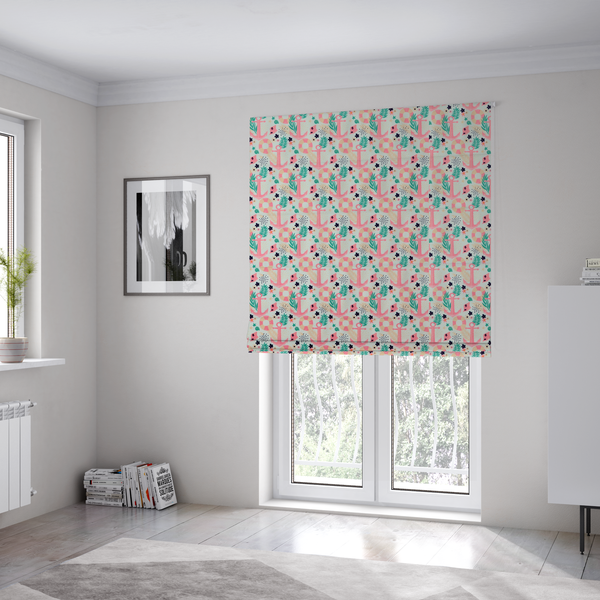 The fabric used to create these Roman blinds is a light mint green fabric with a repeating nautical pattern featuring pink anchors framed by teal palm fronds, interspersed with pink and white striped life rings, tiny dark blue flowers, and small coral shells.