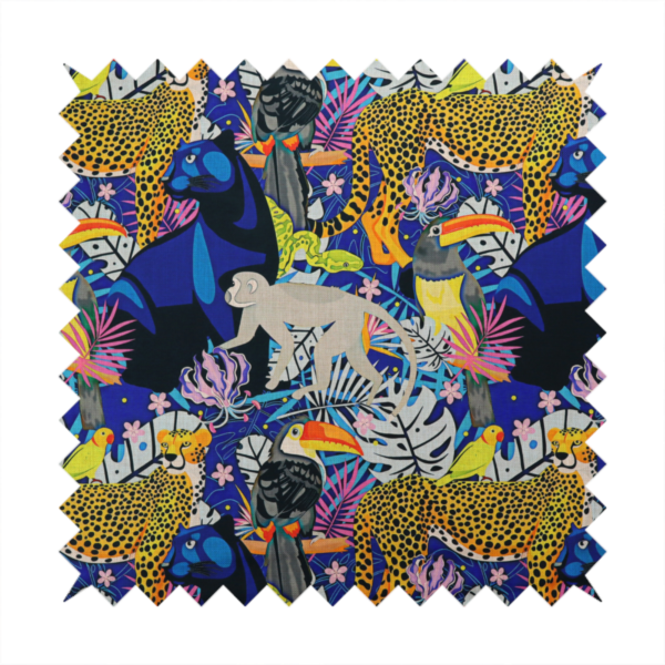 A vibrant jungle-themed fabric on a rich blue background featuring a repeating pattern of yellow leopards with black spots, blue panthers, toucans with bright orange and yellow beaks, light grey monkeys, small yellow-and-red birds, and lush tropical leaves and pink flowers.