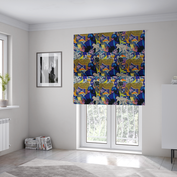 The fabric used to create these Roman blinds is a vibrant jungle-themed fabric on a rich blue background featuring a repeating pattern of yellow leopards with black spots, blue panthers, toucans with bright orange and yellow beaks, light grey monkeys, small yellow-and-red birds, and lush tropical leaves and pink flowers.