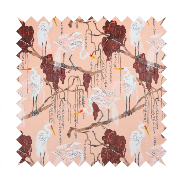 A peach-pink fabric with an illustrated botanical and avian pattern featuring white egrets perched on brown branches among dark red, stylized foliage and weeping floral tendrils.