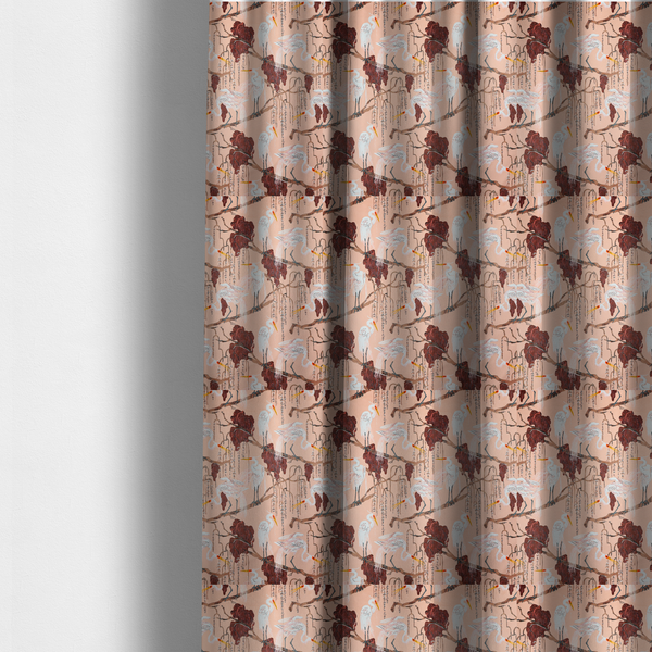 the fabric used to create these made-to-measure curtains is a peach-pink fabric with an illustrated botanical and avian pattern featuring white egrets perched on brown branches among dark red, stylized foliage and weeping floral tendrils.