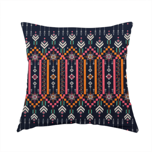 the fabric used to create this handmade cushion is a dark navy blue fabric featuring a repeating geometric pattern with rows of chevron arrows, starburst motifs, and vertical striped panels containing delicate floral vine designs in pink, orange, white, and turquoise.