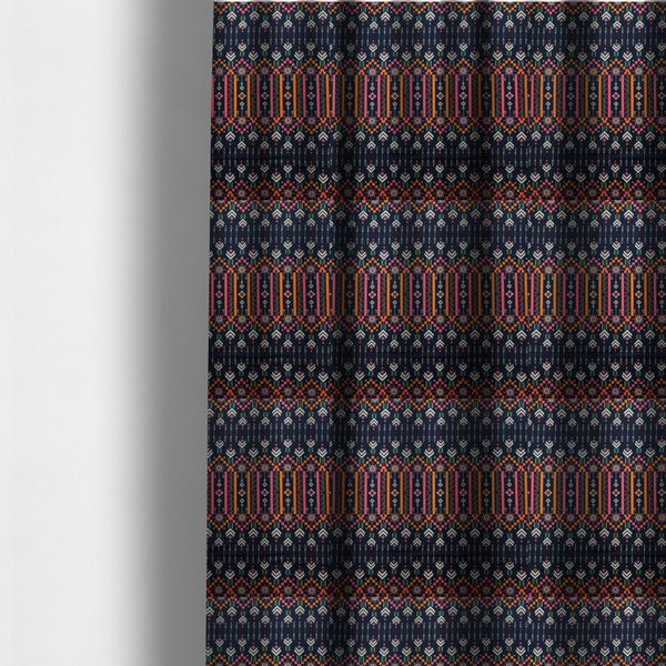 The fabric used to create these made-to-measure curtains is a dark navy blue fabric featuring a repeating geometric pattern with rows of chevron arrows, starburst motifs, and vertical striped panels containing delicate floral vine designs in pink, orange, white, and turquoise.