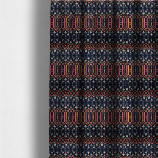 The fabric used to create these made-to-measure curtains is a dark navy blue fabric featuring a repeating geometric pattern with rows of chevron arrows, starburst motifs, and vertical striped panels containing delicate floral vine designs in pink, orange, white, and turquoise.