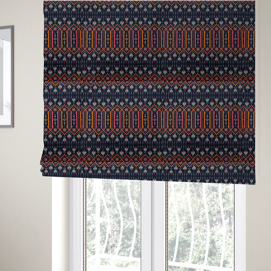 The fabric used to create these Roman blinds is a dark navy blue fabric featuring a repeating geometric pattern with rows of chevron arrows, starburst motifs, and vertical striped panels containing delicate floral vine designs in pink, orange, white, and turquoise.