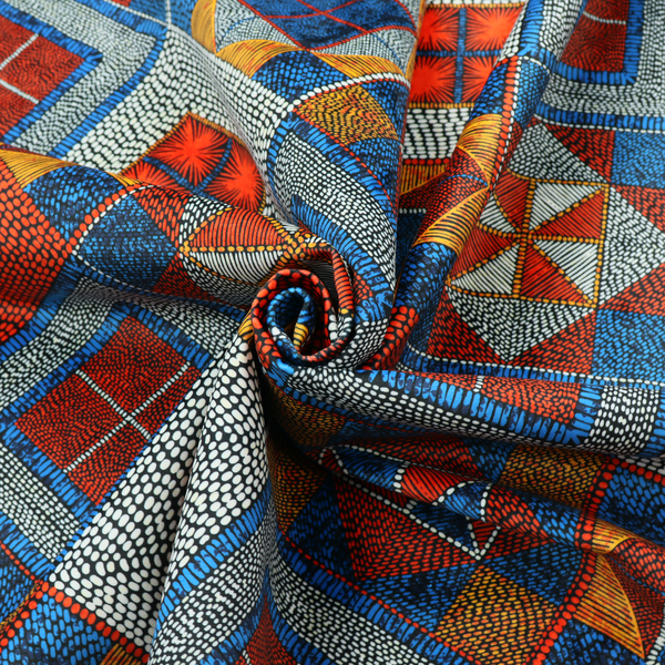 A geometric African wax print fabric featuring an intricate repeating pattern of nested diamonds, squares, and triangular motifs.