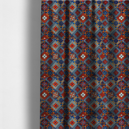 The fabric used to create these made-to-measure curtains is a geometric African wax print fabric featuring an intricate repeating pattern of nested diamonds, squares, and triangular motifs.